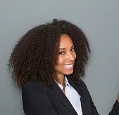 friendly business woman pointing finger close up portrait of a friendly business woman pointing stock photograph csp21477693